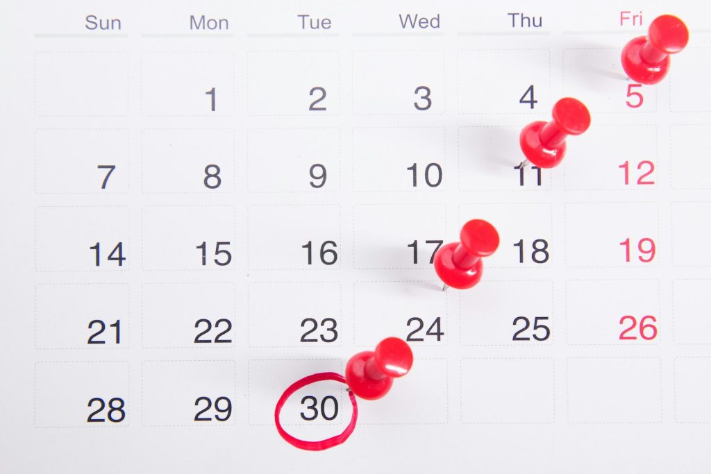 How to Translate Events and Booking Plugins with AI Calendar with push pins representing events and booking translation