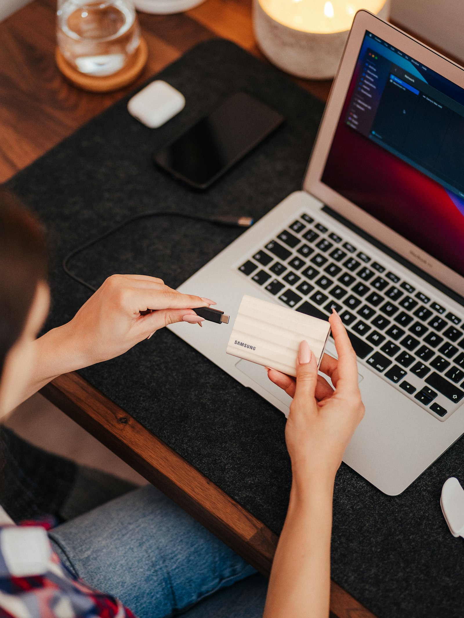 Person typing on a laptop representing a translation plugin comparison
