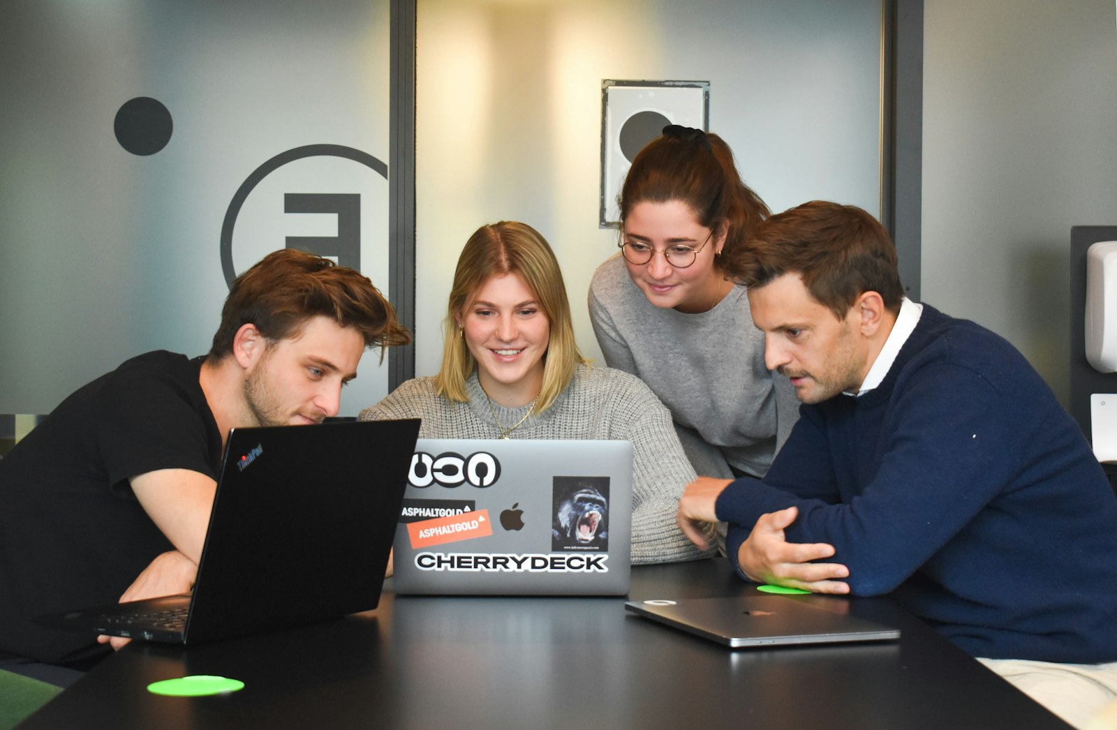 AI Website Translation for SaaS Companies Team working on SaaS software in a modern office