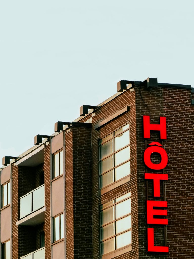 Hotel sign on a building facade representing travel and hospitality